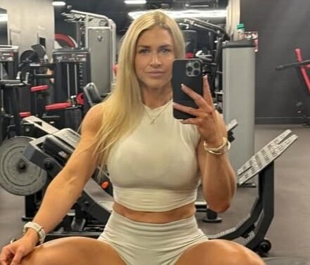 Elise Fulcher in the gym wearing a white outfit