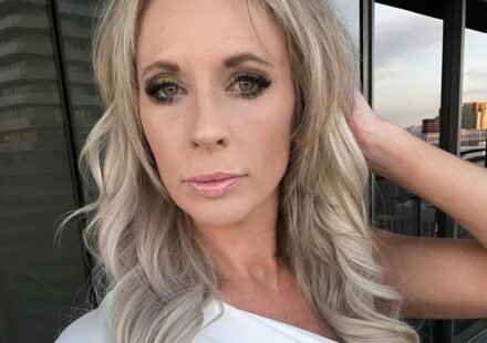 Lexi wearing a white top taking a selfie