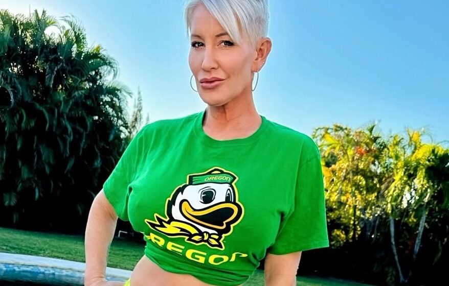 Libby Victoria wearing a green crop top